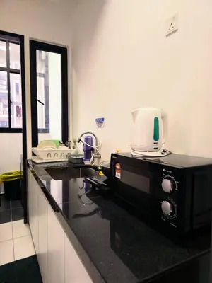 a microwave sitting on a counter in a kitchen at Spacious Luxury Home 3BR 2BA 14pax in George Town