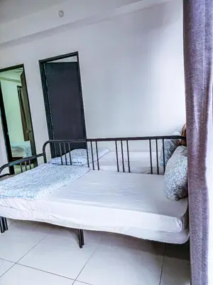 a bedroom with two beds in a room at Spacious Luxury Home 3BR 2BA 14pax in George Town