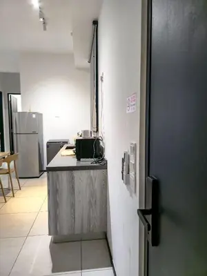 a kitchen with a counter and a refrigerator at Spacious 3BR Seaview Home 10pax a29 in George Town