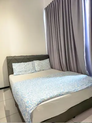a bed in a room with a window and a curtain at Spacious 3BR Seaview Home 10pax a29 in George Town