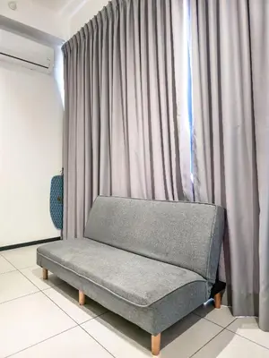 a couch sitting in front of a window at Spacious 3BR Seaview Home 10pax a29 in George Town
