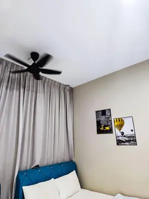 a bedroom with a ceiling fan and a bed at Premium Coastal Haven Beautiful Seaview 12Pax b29 in George Town