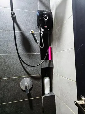 a soap dispenser on a wall in a bathroom at Premium Coastal Haven Beautiful Seaview 12Pax b29 in George Town
