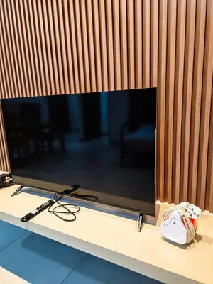 a large flat screen tv sitting on top of a table at High Floor sea view 12 pax 3BR luxury suites b29 in Jelutong