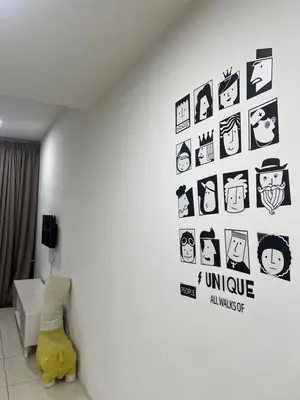a room with a wall with stickers on it at Sunway Onsen superb view 4-6 pax in Tambun