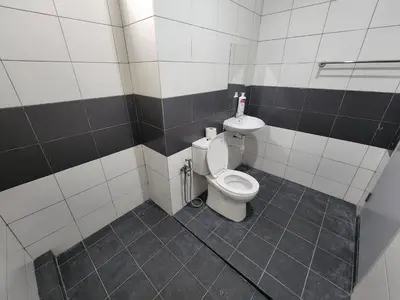 a bathroom with a toilet and a sink at Praicon Tower Hotel Large Suite 3BR - Butterworth in Butterworth