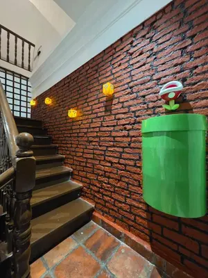 a brick wall with stairs and a green trash can at New ! 6 Pax Super Mario Georgetown Heritage Pre-war House 2 Bedroom in George Town
