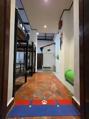 a room with a gym with a red and blue carpet at New ! 6 Pax Super Mario Georgetown Heritage Pre-war House 2 Bedroom in George Town