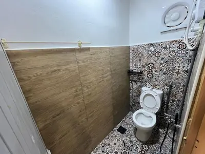 a small bathroom with a toilet and a sink at Menglembu Ipoh Homestay M21 Smart TV & WiFi ready in Ipoh