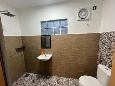 a bathroom with a toilet and a sink and a tv at Menglembu Ipoh Homestay M21 Smart TV & WiFi ready in Ipoh