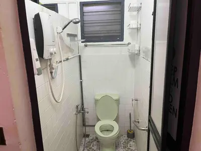 a small bathroom with a toilet and a window at Ipoh Menglembu M35 Smart TV & Wifi ready in Ipoh
