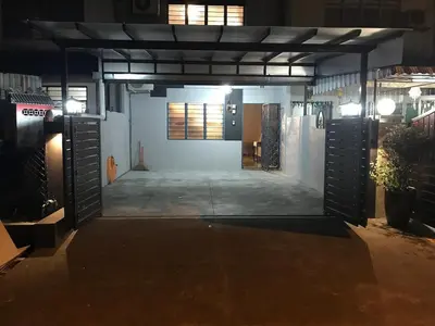 an empty parking lot in a garage at night at Ipoh Menglembu M35 Smart TV & Wifi ready in Ipoh
