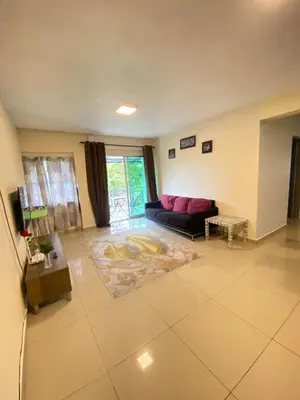 a living room with a couch and a table at Rayyan'Homestay DESA in Tanah Rata