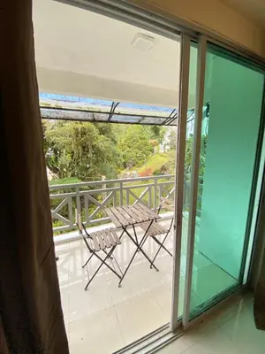 a view of a balcony with a table on the balcony at Rayyan'Homestay DESA in Tanah Rata