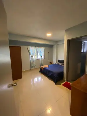 a bedroom with a bed and a window at Rayyan'Homestay DESA in Tanah Rata