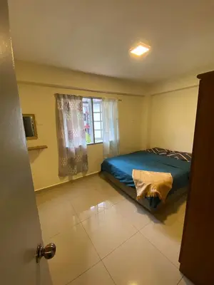 a bedroom with a bed and a window at Rayyan'Homestay DESA in Tanah Rata