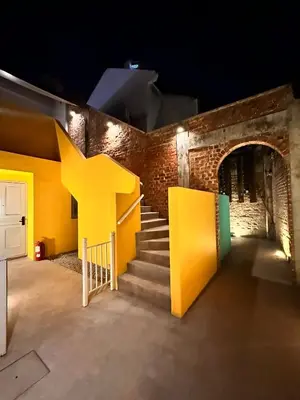 a building with a staircase with a large yellow star on it at Loke Thye Kee Heritage Hotel in George Town