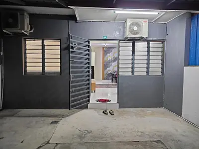 a room with a door and a room with a fan at Margosa Homestay in Ipoh
