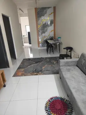 a living room with a couch and a table at Margosa Homestay in Ipoh