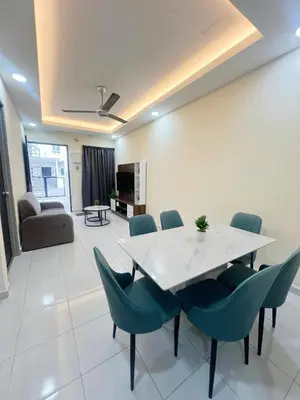 a dining room with a white table and chairs at Homestay Sungai Petani 3 Bedroom in Taman Mutiara Bandar Puteri Jaya by D'Aleena Homes in Sungai Petani