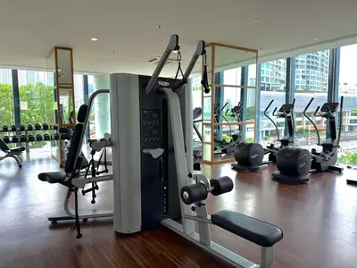 a gym with cardio equipment in a building at Landmark Seaview Cozy Family Suite with Balcony 6 Pax in Tanjong Tokong
