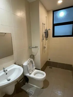 a bathroom with a toilet and a sink at Oasis Condominium Ipoh in Ipoh