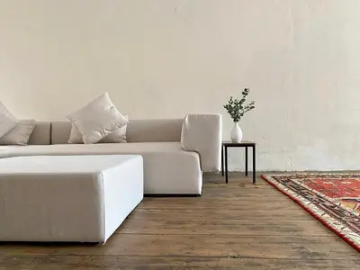 a living room with a white couch and a table at Cheong Fatt Tze - The Townhouses in George Town