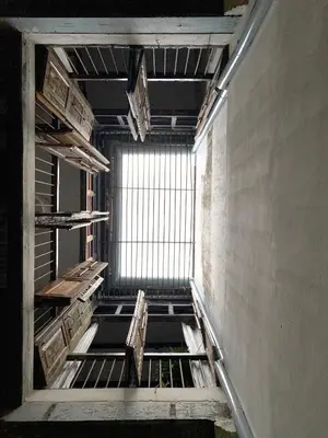 an empty room with a window in a building at Cheong Fatt Tze - The Townhouses in George Town