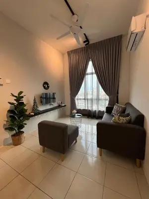 a living room with a couch and a ceiling fan at Ipoh Modern Skyline & Mountain View Suite in Ipoh