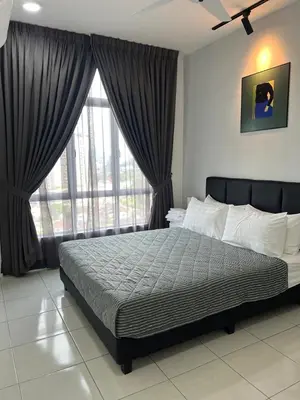 a bedroom with a bed and a large window at Ipoh Modern Skyline & Mountain View Suite in Ipoh