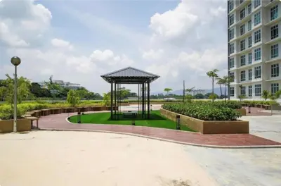 a gazebo in a park next to a building at Ipoh Modern Skyline & Mountain View Suite in Ipoh