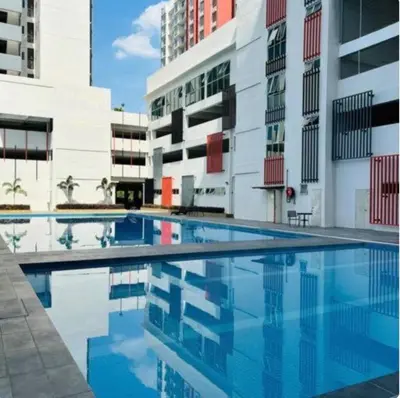 a swimming pool in the middle of a building at Ipoh Modern Skyline & Mountain View Suite in Ipoh