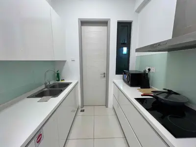 a white kitchen with a sink and a microwave at High floor Seaview 2BR Jazz Suite Bathtub &Sauna in Tanjong Tokong