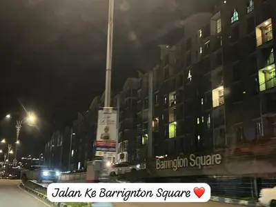 a city street at night with a building at Barrington Square Aleysha Homestay Night Market in Brinchang