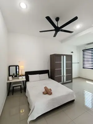 a bedroom with a bed and a ceiling fan at Lahat Serenity 168 Big Corner Cozy House in Lahat