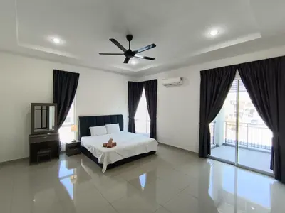 a bedroom with a bed and a ceiling fan at Lahat Serenity 168 Big Corner Cozy House in Lahat