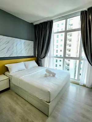 a bedroom with a large bed with a large window at Pico City Suite #1BR in George Town