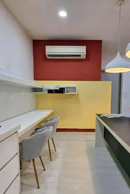 a kitchen with a white table and two chairs at Pico City Suite #1BR in George Town