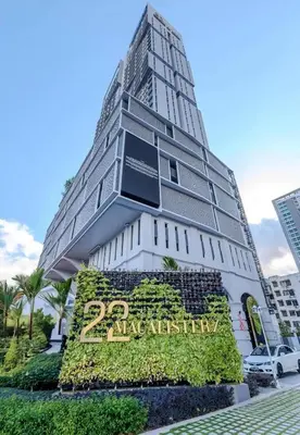 a building with a sign in front of it at 22Macalisterz Georgetown Studio in George Town