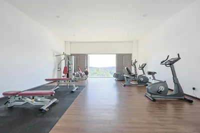 a gym with several treadmills and exercise bikes at Palas Horizon Brinchang Cameron Highlands -C Home Luxury A-1-18 in Brinchang