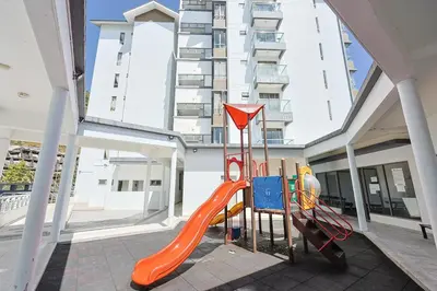 a playground with an orange slide in a building at Palas Horizon Brinchang Cameron Highlands -C Home Luxury A-1-18 in Brinchang