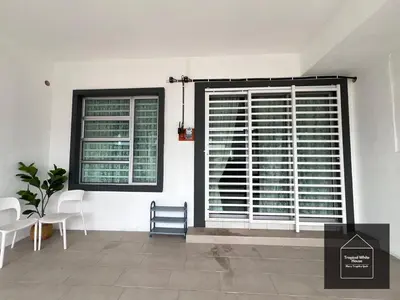 a room with two windows and a table and chairs at Zafirah Ipoh Homestay Musllim Only in Ipoh