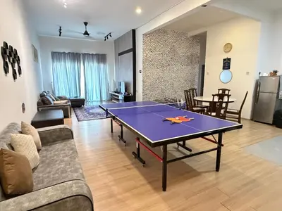 a living room with a ping pong table in it at AYAAN GAMING CLUB House with PS4 & Table Tennis at Cameron Highland in Tanah Rata