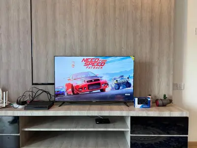 a television sitting on a table in a room at AYAAN GAMING CLUB House with PS4 & Table Tennis at Cameron Highland in Tanah Rata