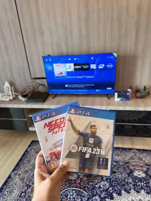 a person holding up a nintendo wii game magazine at AYAAN GAMING CLUB House with PS4 & Table Tennis at Cameron Highland in Tanah Rata
