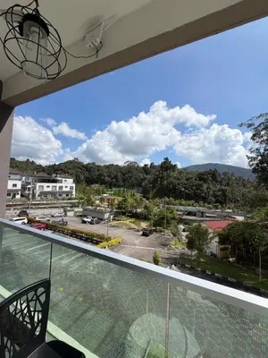 a balcony with a view of a parking lot at AYAAN ELITE HOME at Quintet Apartment with free parking & Ps4 Gaming and Netflix in Tanah Rata