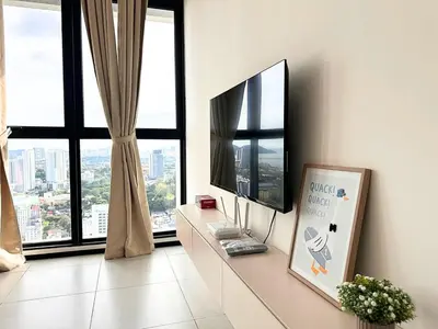 a living room with a tv and a large window at Urban Seaview, City view, New 3BR 6pax, Jelutong in George Town