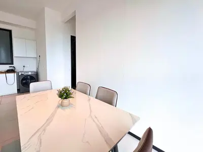 a dining room with a table and chairs at Urban Seaview, City view, New 3BR 6pax, Jelutong in George Town