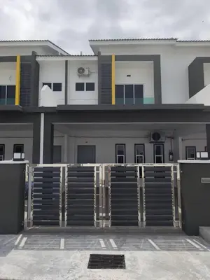 a building with a gate in front of it at pangkor 71 homestay in Pasir Bogak