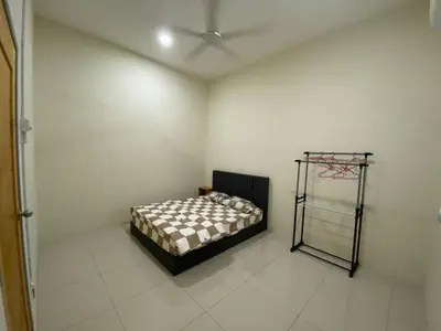 a room with a bed in the corner of a room at 96 HomeStay Sungai Besar in Sungai Besar